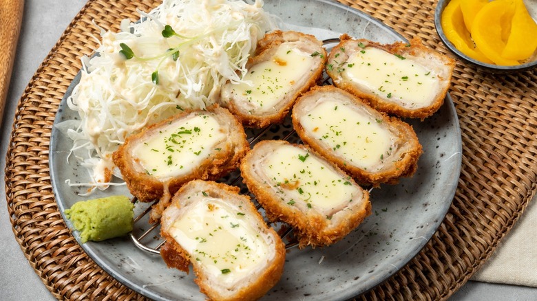 plate of pork katsu stuffed with cheese