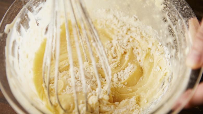 Cake batter in bowl with whisk