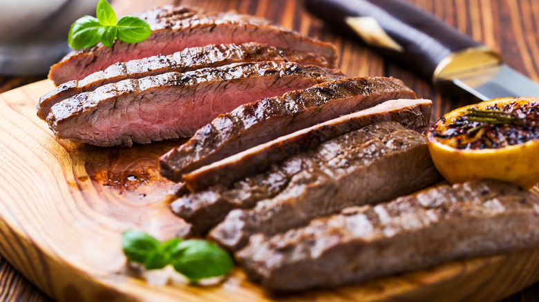 Leftover sliced steak on cutting board 