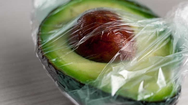 avocado half in plastic
