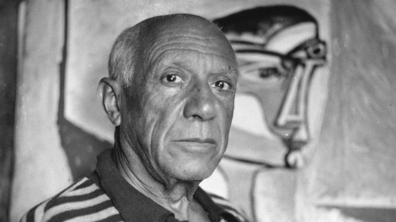 Picasso in front of painting