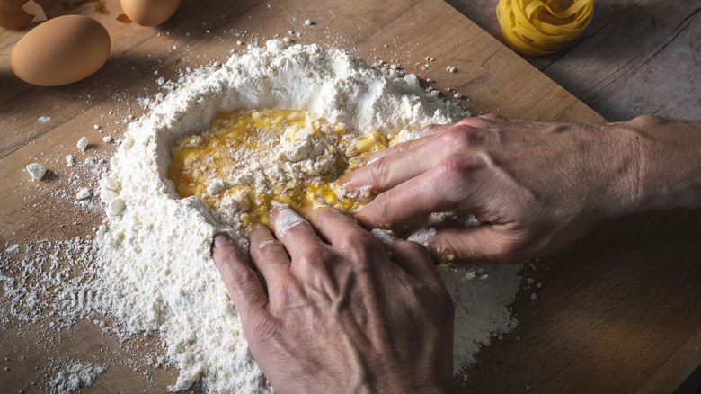 Hands with pasta dough 