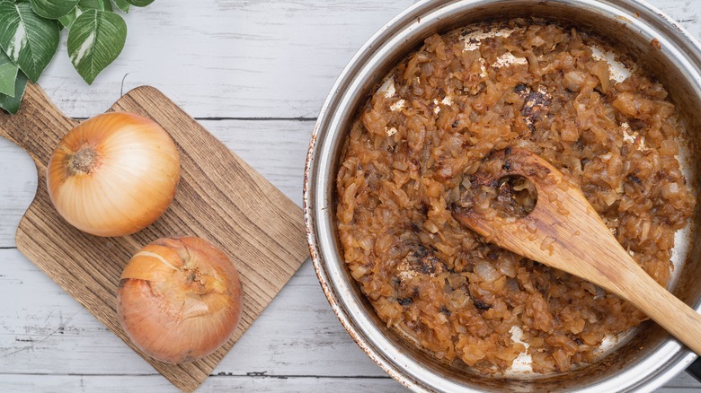 pan of caramelized onions with whole onions