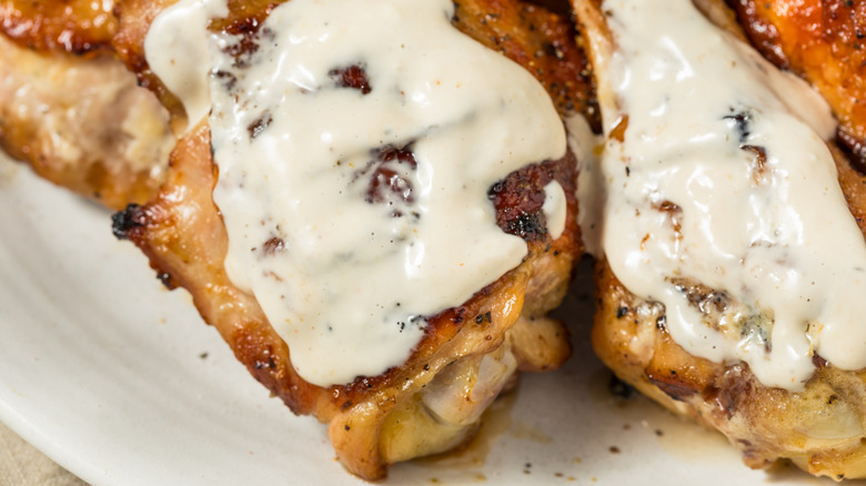 Close-up of chicken covered in white sauce