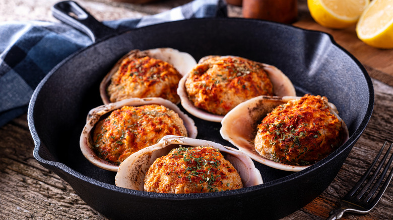 Cast iron skillet full of stuffed clams