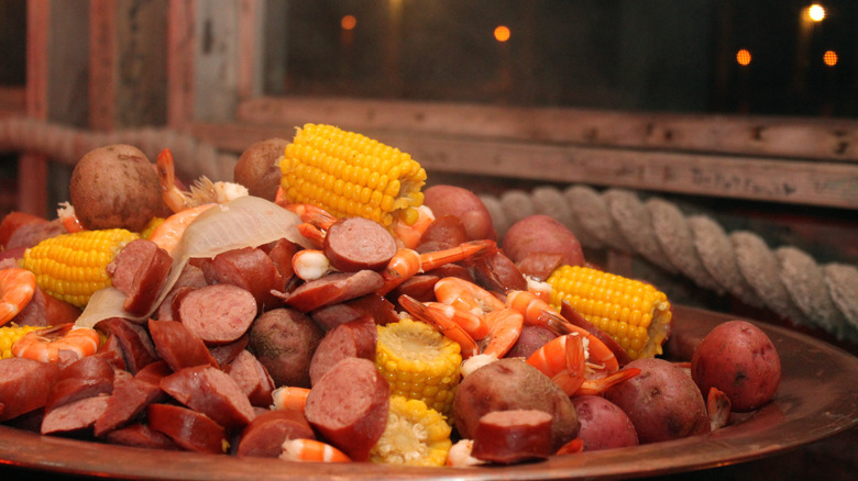 Huge pile of shrimp, sausage, corn, and potatoes