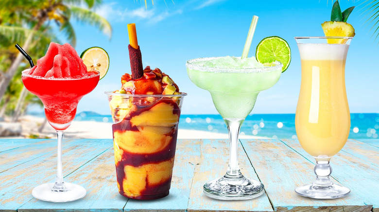 Assorted frozen drinks with beach in the background