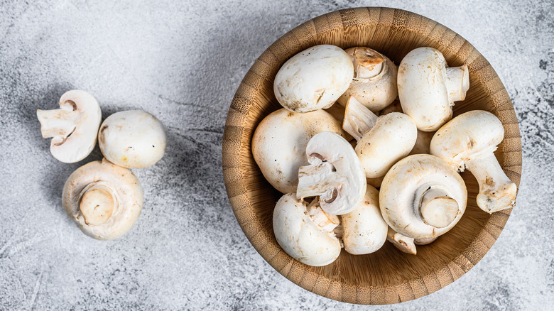 white button mushrooms in a bowl