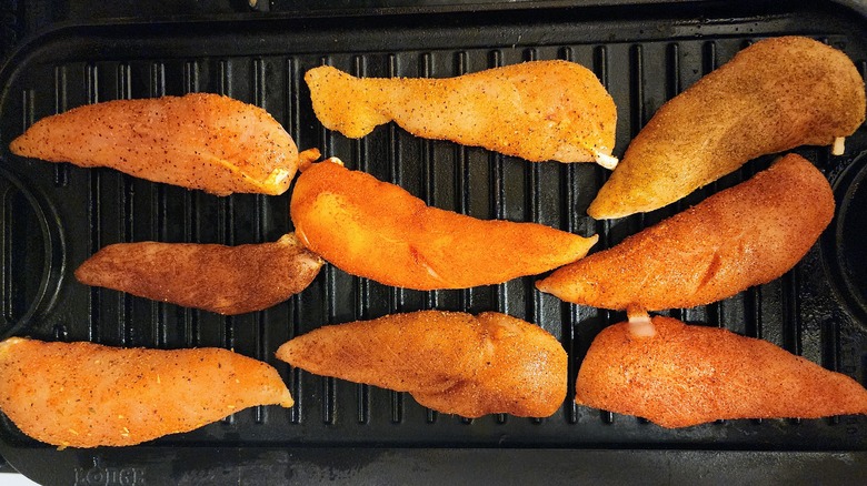 Chicken tenders on grill