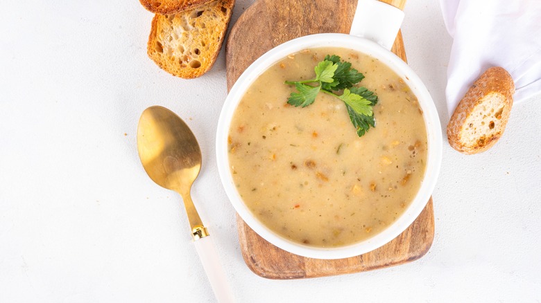 soup in bowl on board