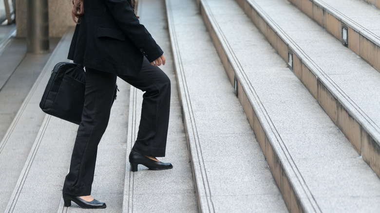 Woman walking with briefcase 