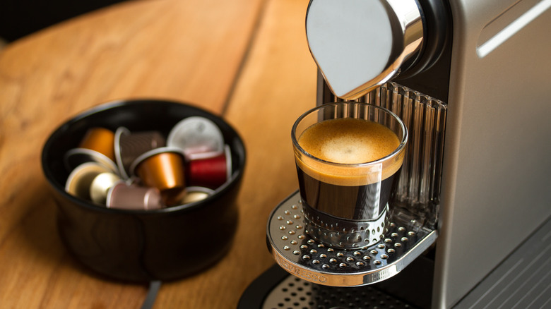 nespresso machine brewing coffee