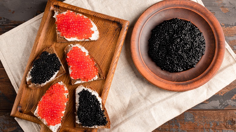 Red and black caviar on toast