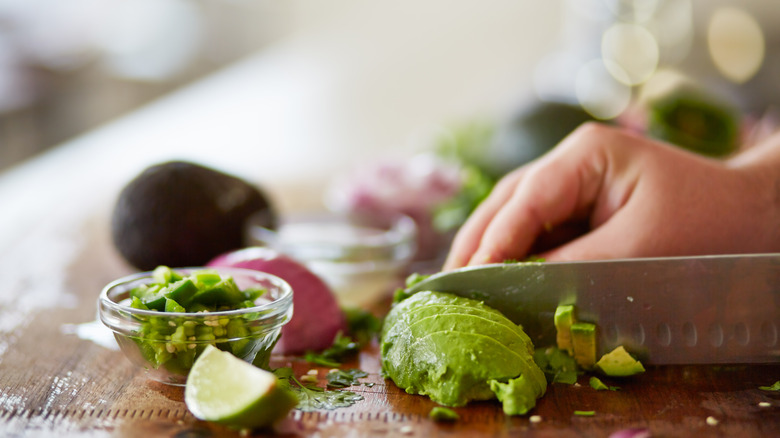 Avocado being sliced