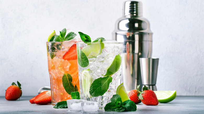 mojitos in glasses with shaker