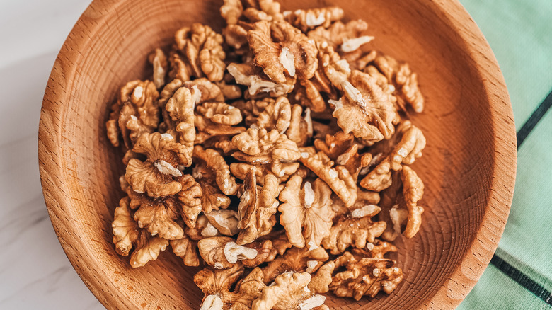 wooden bowl of walnuts