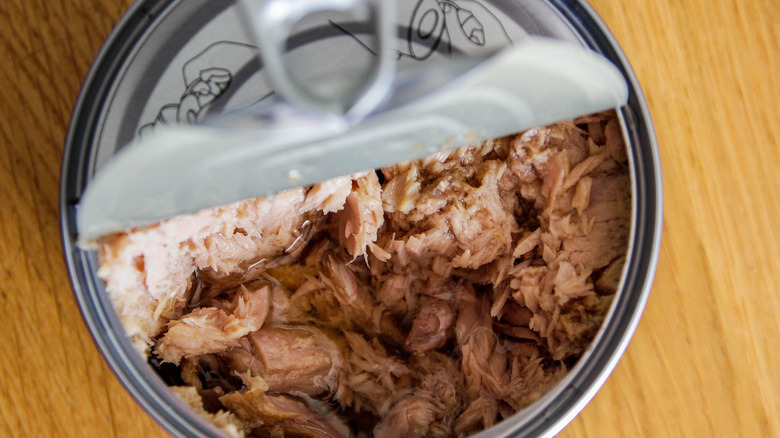 canned tuna on wood surface