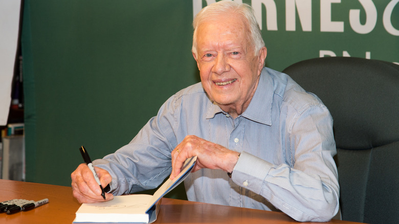 Jimmy Carter signing a book