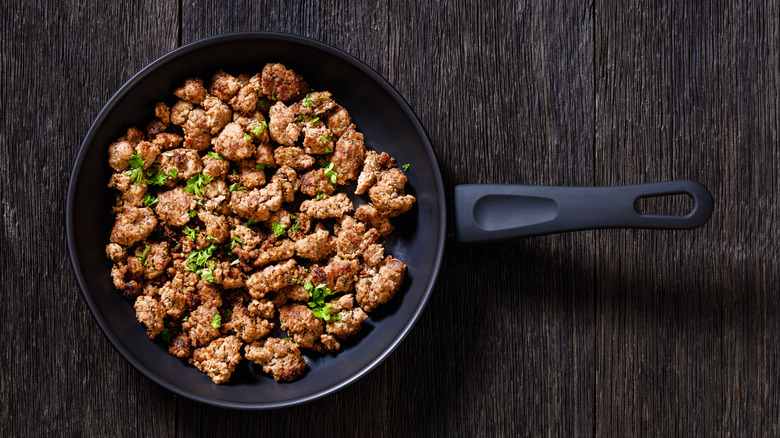 sausage with herbs in skillet