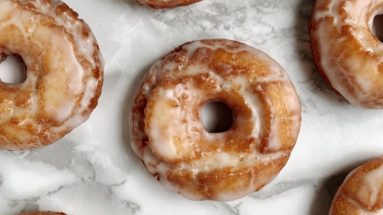 An array of sour cream glazed donuts