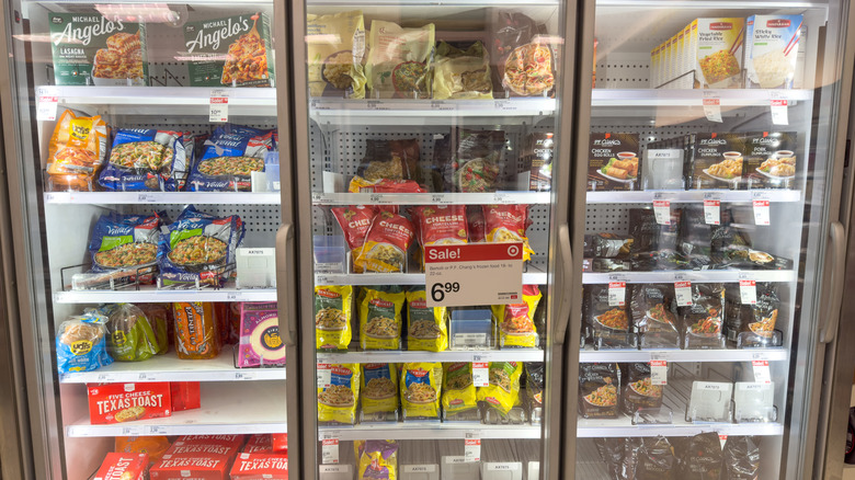 Various frozen meals and other items in grocery store frozen aisle
