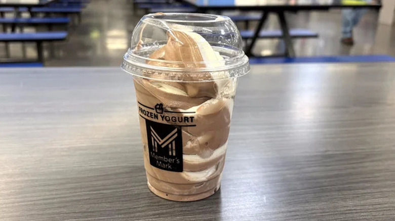 A cup of Sam's Club chocolate vanilla swirl frozen yogurt sits on a table