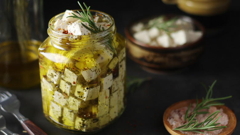 jar of marinated feta with rosemary