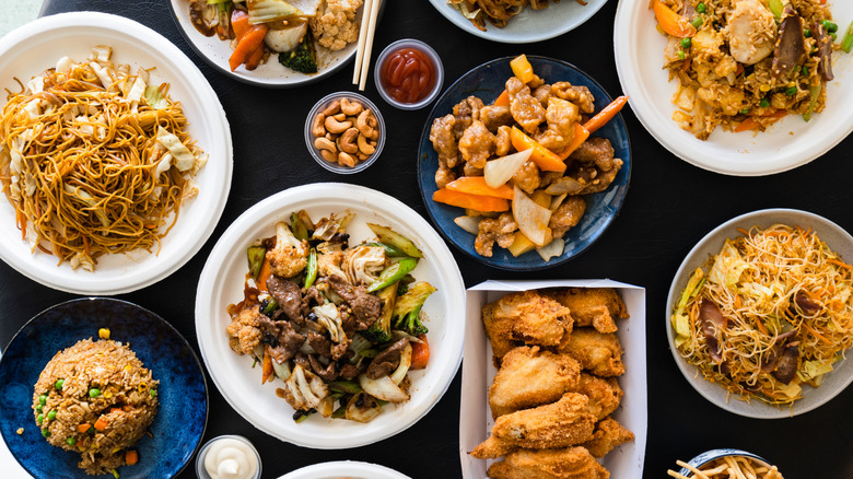 Various Chinese food dishes on a table