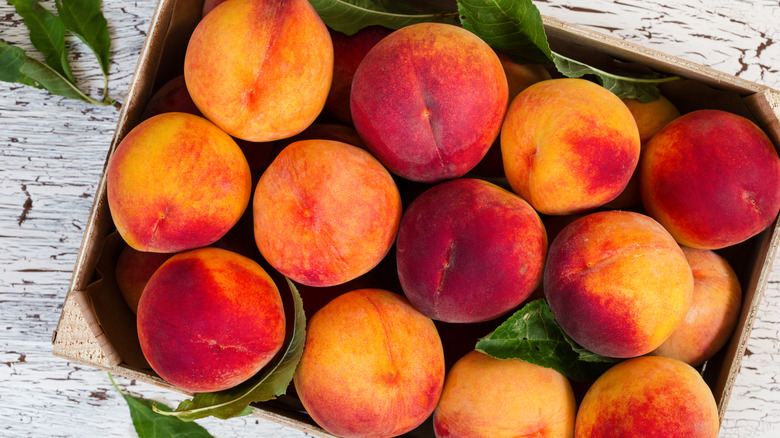 Fresh peaches in a crate