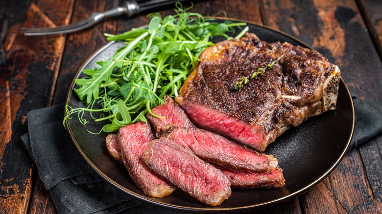 Sliced steak and arugula