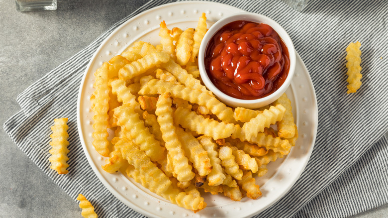 homemade crinkle cut fries with ketchup