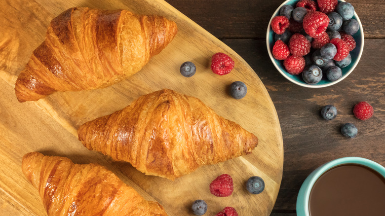 croissants on wooden tray