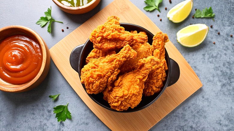 Fried chicken and ketchup with limes