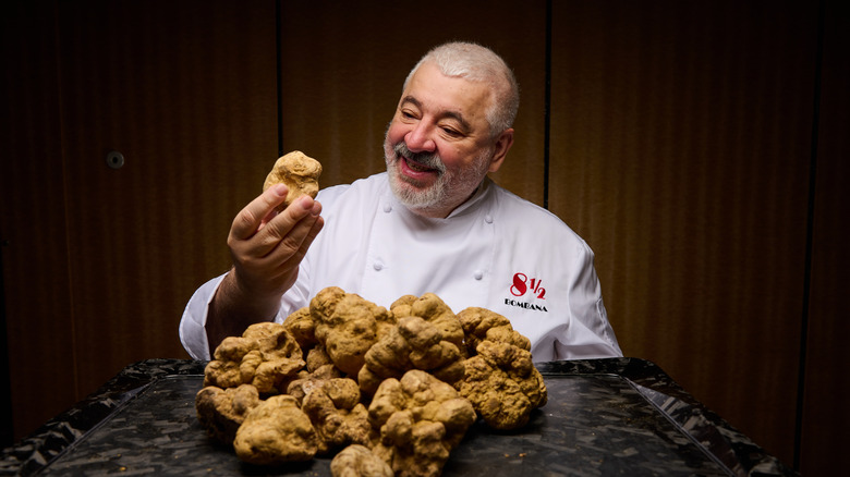 Bombana holding a white truffle