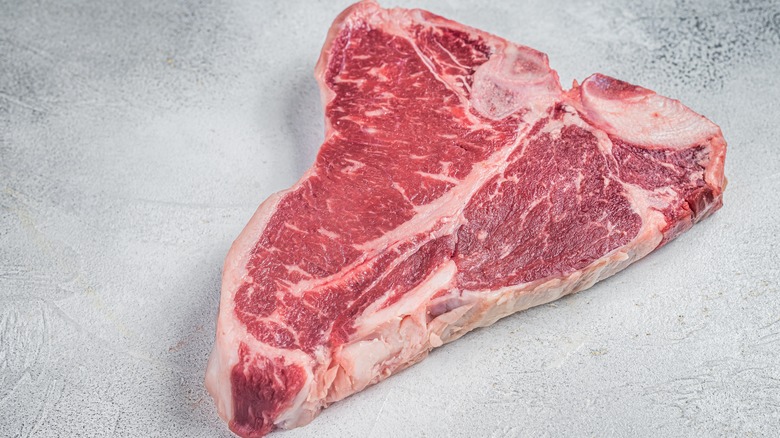 A raw porterhouse T-bone steak