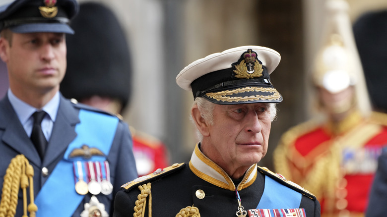 King Charles III followed by Prince William