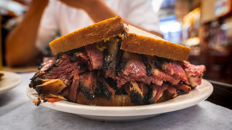 Cut pastrami sandwich