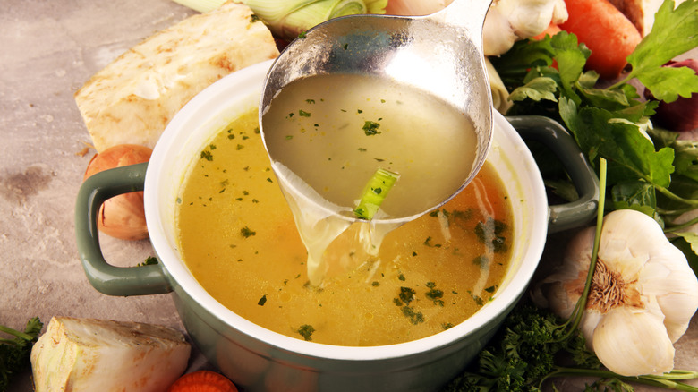 Pot of broth with vegetables