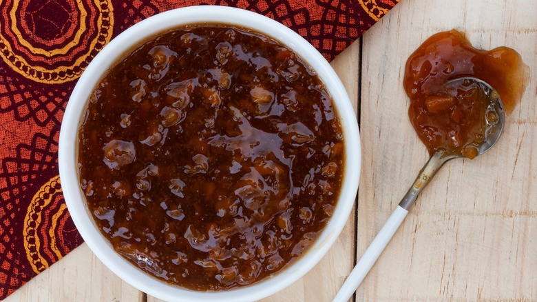 Red chutney spilled on table