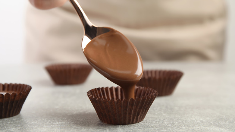 chocolate poured into cupcake liner