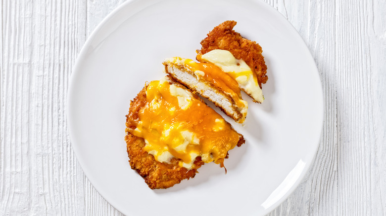 A parmo on white plate