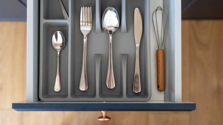 clean organized silverware drawer opening