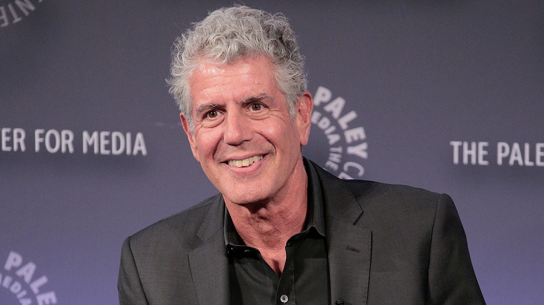 Anthony Bourdain smiling at event