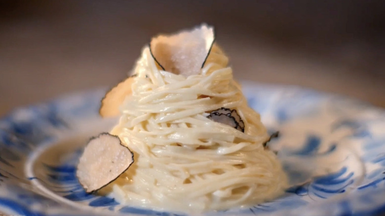 a mound of tagliolini with truffle