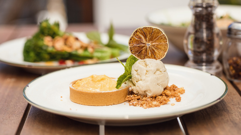 gourmet lemon tart on wooden table