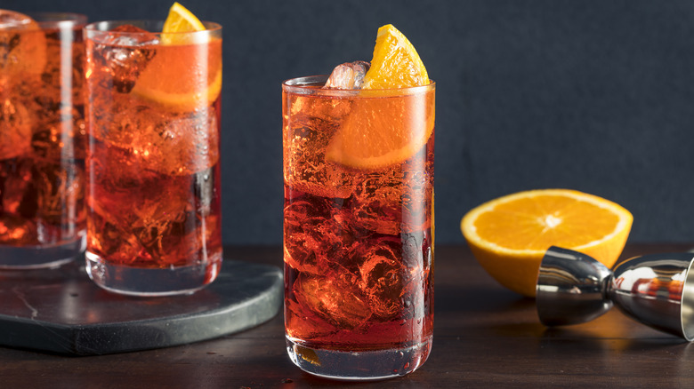 Americano cocktail with orange wedge