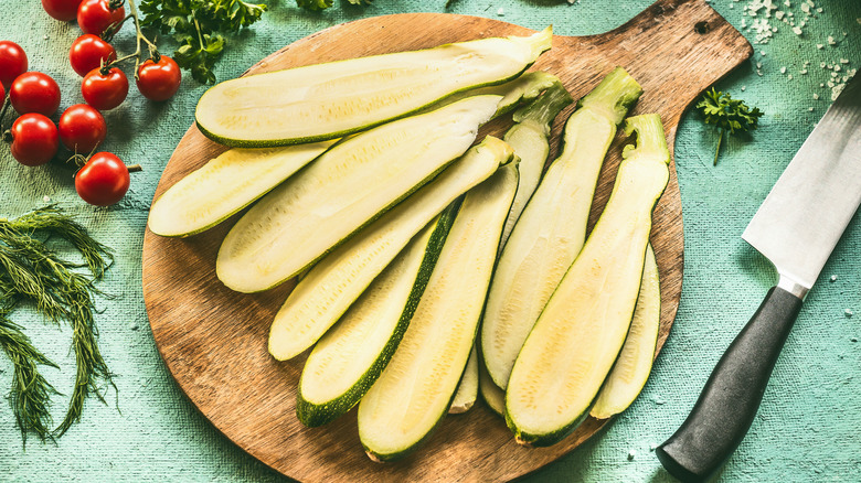 halved zucchini on cutting board