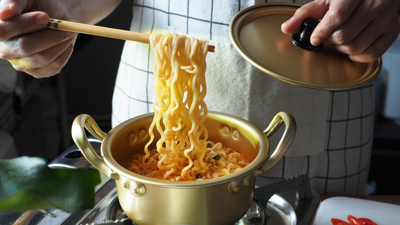 pulling ramen noodles with chopsticks