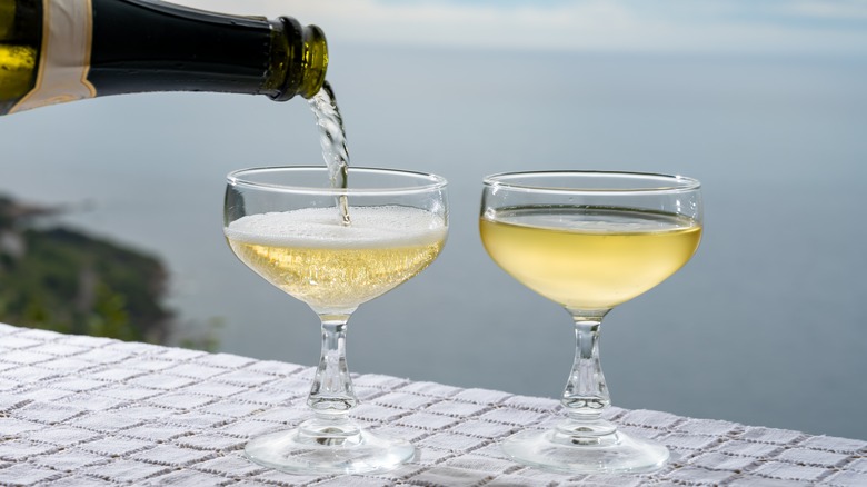 cava wine poured into glasses outside