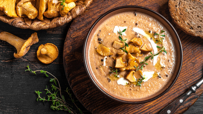 bowl of creamy mushroom soup with fresh thyme